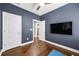 Well-lit exercise room with hardwood floors and large wall-mounted TV at 2013 Rockledge Ne Rd, Atlanta, GA 30324