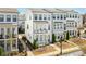 Beautiful townhome showcasing multiple balconies and pristine landscaping; inviting curb appeal for new homeowners at 2013 Rockledge Ne Rd, Atlanta, GA 30324