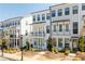 Charming townhome featuring a classic exterior design with inviting balconies and manicured landscaping at 2013 Rockledge Ne Rd, Atlanta, GA 30324