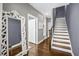 Hallway with open staircase and decorative mirror creating an open feel at 2013 Rockledge Ne Rd, Atlanta, GA 30324