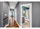 Hallway with hardwood floors leading to a full bathroom with modern finishes at 2013 Rockledge Ne Rd, Atlanta, GA 30324