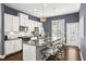 Bright kitchen featuring white cabinets, a stainless steel appliance suite, and a large island with granite countertops at 2013 Rockledge Ne Rd, Atlanta, GA 30324