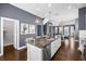 Expansive kitchen with a central island, white cabinets, a dining area, and modern appliances for the home chef at 2013 Rockledge Ne Rd, Atlanta, GA 30324