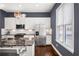 Well-equipped kitchen featuring stainless steel appliances, an island with bar seating, and ample natural light at 2013 Rockledge Ne Rd, Atlanta, GA 30324