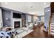 Open-concept living room with hardwood floors, a fireplace, and access to the dining area, perfect for entertaining at 2013 Rockledge Ne Rd, Atlanta, GA 30324