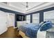 Inviting main bedroom featuring hardwood floors, a fan, and a large closet space at 2013 Rockledge Ne Rd, Atlanta, GA 30324