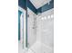 Shower with marble-style walls and a glass partition, offering a clean and modern look at 2013 Rockledge Ne Rd, Atlanta, GA 30324