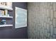 Stylish interior featuring textured wallpaper and a blue-themed graphic wall art piece and floating shelves at 2013 Rockledge Ne Rd, Atlanta, GA 30324
