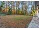 This home features a large fenced-in backyard with mature trees at 2903 Akron Street, East Point, GA 30344