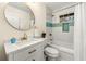 Stylish bathroom featuring modern fixtures, a vanity with a sink, a bathtub with shower, and neutral tones at 2903 Akron Street, East Point, GA 30344