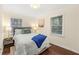 This cozy bedroom features hardwood floors and warm natural light from the two windows at 2903 Akron Street, East Point, GA 30344