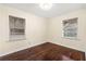 This bedroom has natural lighting with hardwood floors and two windows at 2903 Akron Street, East Point, GA 30344