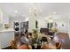 Open-concept space with a dining area, modern lighting, and seamless flow to the kitchen and living room at 2903 Akron Street, East Point, GA 30344