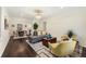 Cozy living room featuring hardwood floors, a modern sofa, comfortable armchairs, and a stylish rug at 2903 Akron Street, East Point, GA 30344