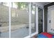 Back porch featuring stone wall, string lights, and black steel gate at 64 Saint Claire Ne Ln, Atlanta, GA 30324