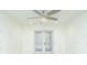 Bright bedroom with ceiling fan and view of backyard, blending comfort and style at 64 Saint Claire Ne Ln, Atlanta, GA 30324