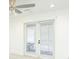 Bright bedroom with ceiling fan and view of backyard, blending comfort and style at 64 Saint Claire Ne Ln, Atlanta, GA 30324