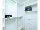 Well-organized closet offering ample storage with shelves, drawers, and hanging rods, creating a neat and functional space at 64 Saint Claire Ne Ln, Atlanta, GA 30324