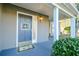 Charming entryway with a light blue front door, decorative wreath, and covered porch at 64 Saint Claire Ne Ln, Atlanta, GA 30324