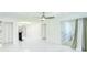 Spacious living area with marble floors, modern lighting, and French doors to adjacent rooms at 64 Saint Claire Ne Ln, Atlanta, GA 30324