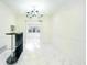Bright room featuring marble floors, modern lighting, and adjacent black bar area at 64 Saint Claire Ne Ln, Atlanta, GA 30324