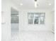 Bright room featuring clean lines, neutral walls, tiled floors, and ample natural light, creating a fresh and airy atmosphere at 64 Saint Claire Ne Ln, Atlanta, GA 30324