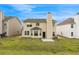 View of home's backyard with green grass and exterior features at 2760 Carolina Rdg, Riverdale, GA 30296