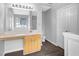 Bathroom featuring a sink and wood cabinets with a large, lighted mirror at 2760 Carolina Rdg, Riverdale, GA 30296