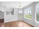 Dining room featuring hardwood floors, natural light from the windows, and access to more rooms at 2760 Carolina Rdg, Riverdale, GA 30296