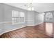 Dining room featuring hardwood floors, natural light from the windows, and chandelier at 2760 Carolina Rdg, Riverdale, GA 30296