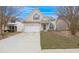 Charming home featuring a two-car garage, complemented by a well-maintained lawn and a welcoming entrance at 2760 Carolina Rdg, Riverdale, GA 30296