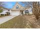 Charming home featuring a two-car garage, complemented by a well-maintained lawn and a welcoming entrance at 2760 Carolina Rdg, Riverdale, GA 30296