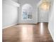 Bright living room with hardwood floors, vaulted ceilings, and a large window for ample natural light at 2760 Carolina Rdg, Riverdale, GA 30296