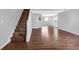 Spacious living room with hardwood floors and staircase to upstairs at 2760 Carolina Rdg, Riverdale, GA 30296
