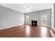 Spacious living room with fireplace, ceiling fan, and hardwood floors at 2760 Carolina Rdg, Riverdale, GA 30296