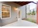Back patio with a view of the raised garden beds, small shrubs and a view of the neighboring homes at 399 Se Skylar Way, Atlanta, GA 30315