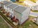 A back view of a three-story home featuring a wooden deck and a well maintained lawn at 399 Skylar Way, Atlanta, GA 30315