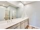 Bathroom featuring double sinks, spacious countertop, and walk-in shower at 399 Se Skylar Way, Atlanta, GA 30315