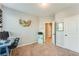 Bright bedroom with multiple windows and a full workspace with a blue desk at 399 Se Skylar Way, Atlanta, GA 30315