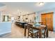 Bright, open-concept kitchen with stainless steel appliances and eat-in island overlooking the dining area at 399 Se Skylar Way, Atlanta, GA 30315