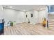 Living room featuring a hardwood floor and a variety of doors offering access to other rooms at 399 Se Skylar Way, Atlanta, GA 30315