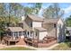 Spacious backyard with a large deck, screened in porch, and hot tub at 4103 Devon Wood Ne Dr, Marietta, GA 30066
