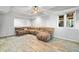 Finished basement featuring wood-look tile flooring and a large sectional sofa at 4103 Devon Wood Ne Dr, Marietta, GA 30066