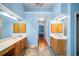Bathroom with double sinks, ample counter space, and a connecting doorway at 4103 Devon Wood Ne Dr, Marietta, GA 30066