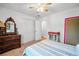 Bedroom with a ceiling fan, traditional dresser, and view of a closet at 4103 Devon Wood Ne Dr, Marietta, GA 30066