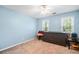 Comfortable bedroom with natural light and neutral décor at 4103 Devon Wood Ne Dr, Marietta, GA 30066