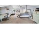 Large bedroom with a bed, desk, treadmill, and carpeted floors at 4103 Devon Wood Ne Dr, Marietta, GA 30066