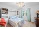 Cozy bedroom with built-in shelving, a window view, and comfortable furnishings at 4103 Devon Wood Ne Dr, Marietta, GA 30066