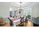 Dining room featuring a tray ceiling and a view into the foyer at 4103 Devon Wood Ne Dr, Marietta, GA 30066