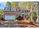 Beautiful two-story brick home with well-manicured landscaping and a two-car garage at 4103 Devon Wood Ne Dr, Marietta, GA 30066